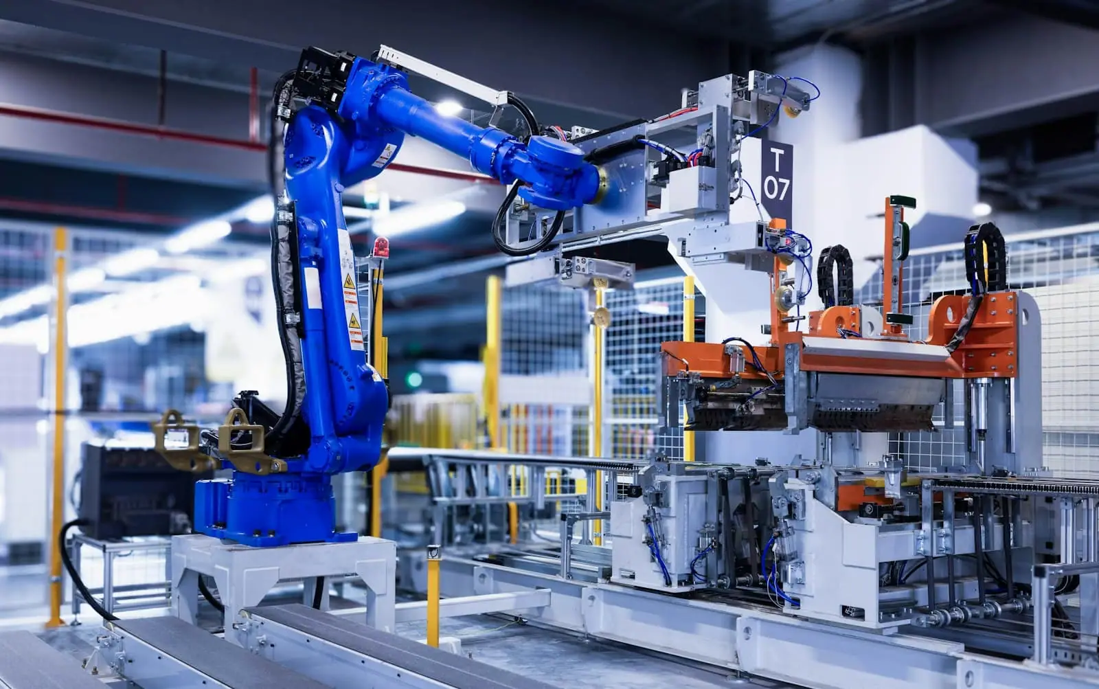 An industrial robot arm on a factory line