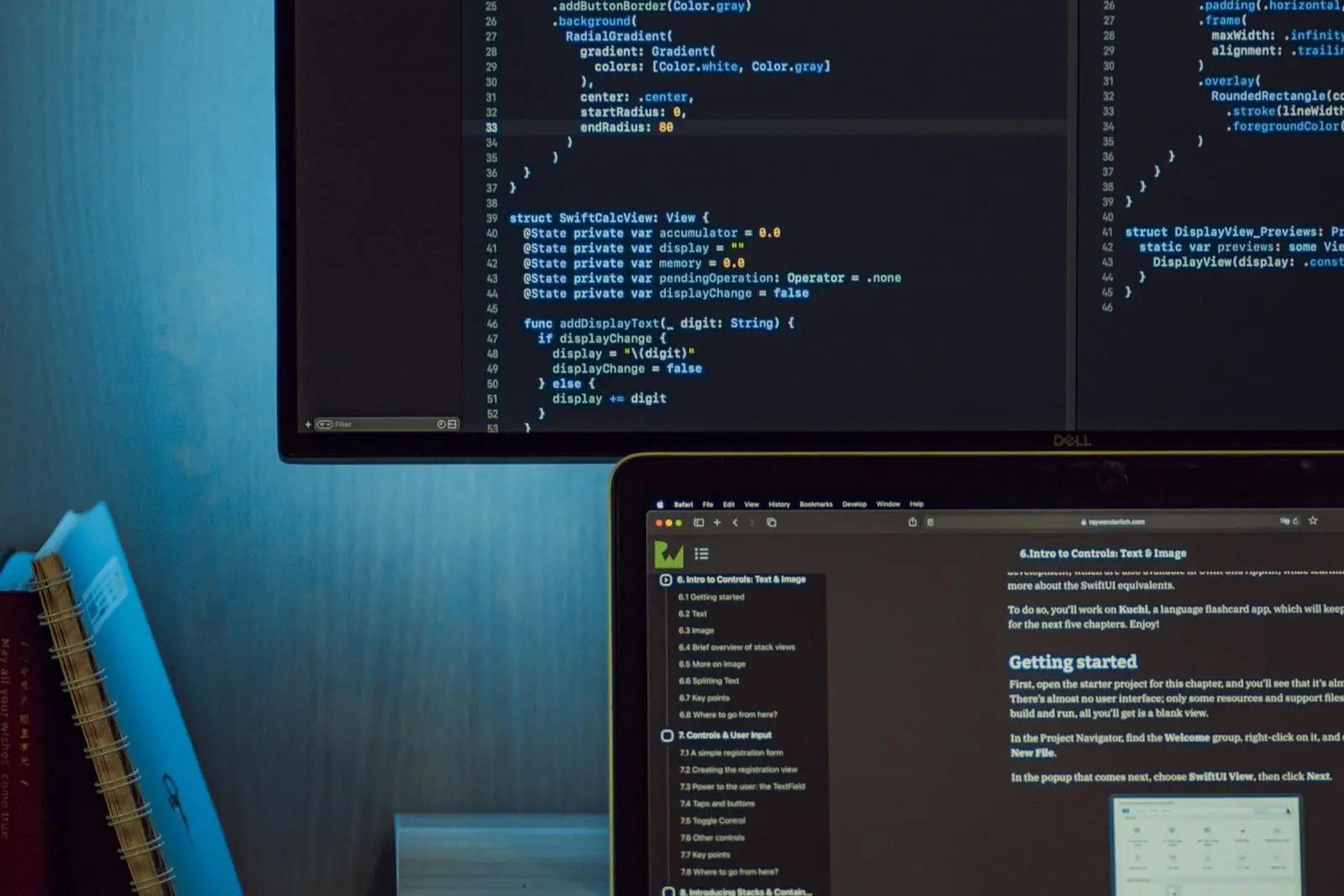 Code and test notes across a monitor and laptop